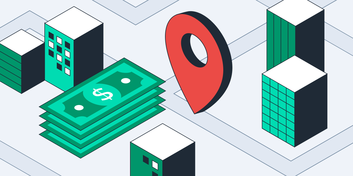 Pin in a map next to a stack of money